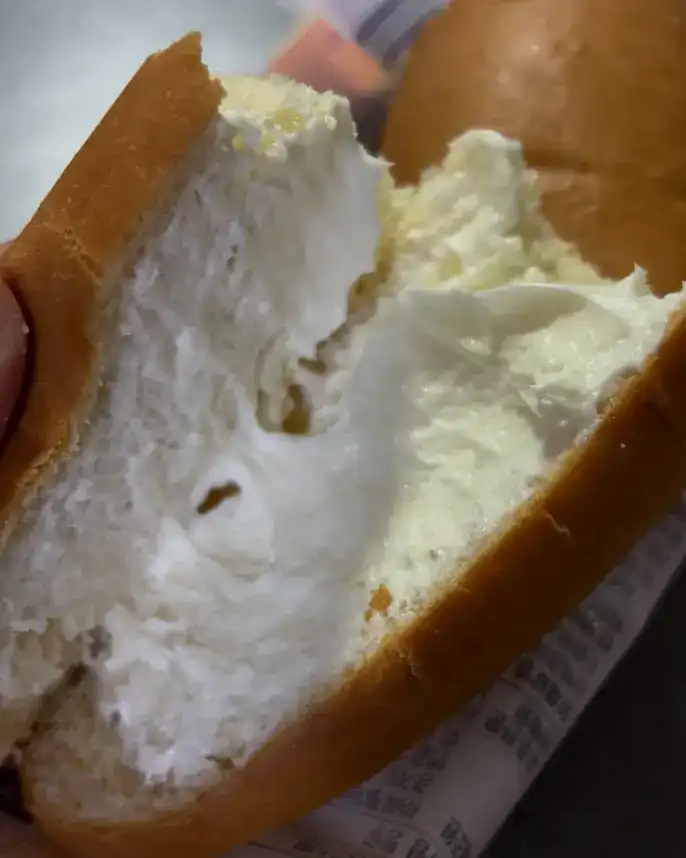 Close-up of the strawberry jam and cream inside the pastry