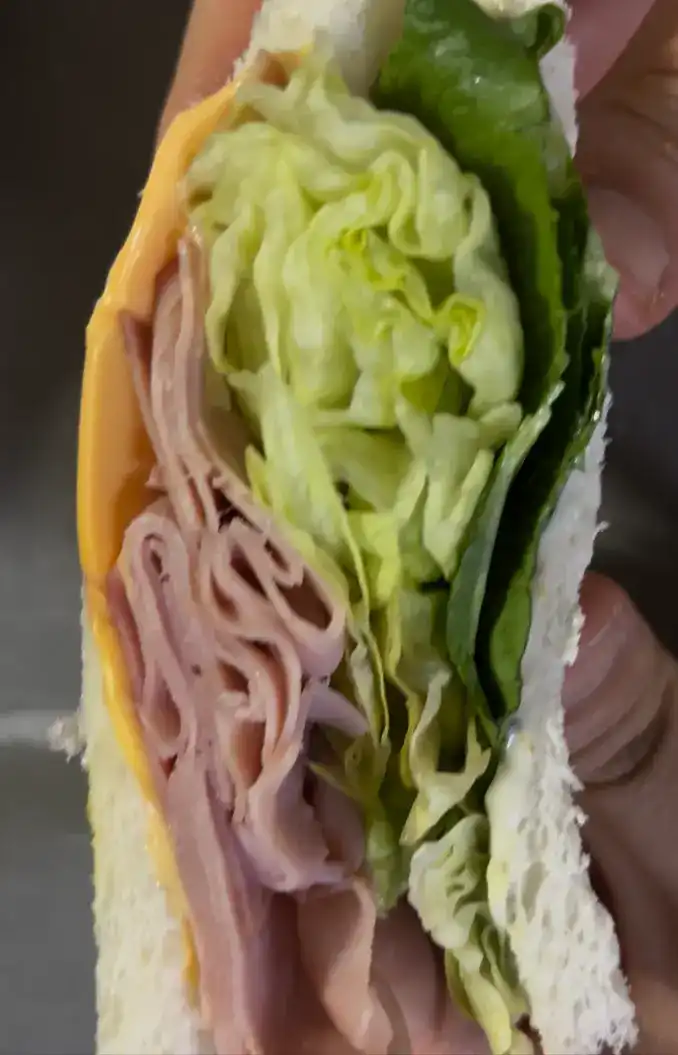 Close-up of the creamy egg salad half of the sandwich