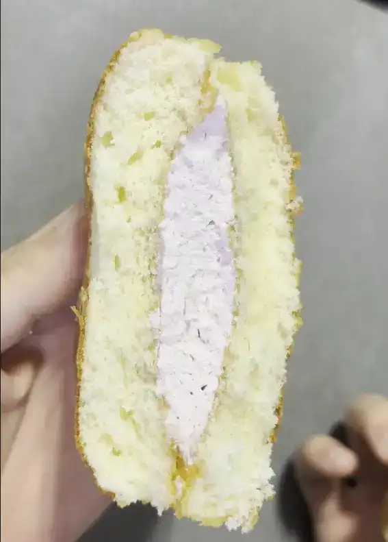 Close-up of the thick strawberry cream layer inside the cake