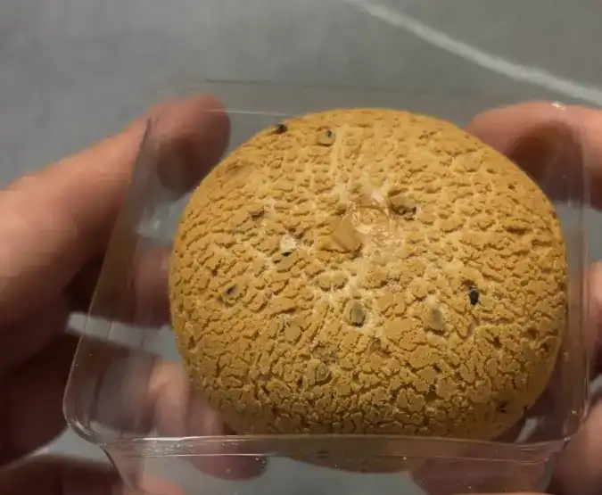 The fully unwrapped custard sesame bread ready to eat