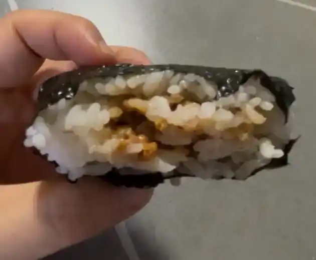 Inside look of the GS25 Soft Chicken Mayo Triangle Kimbap showing the sparse filling