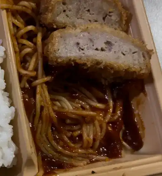 A look at the spaghetti hidden underneath the pork cutlet