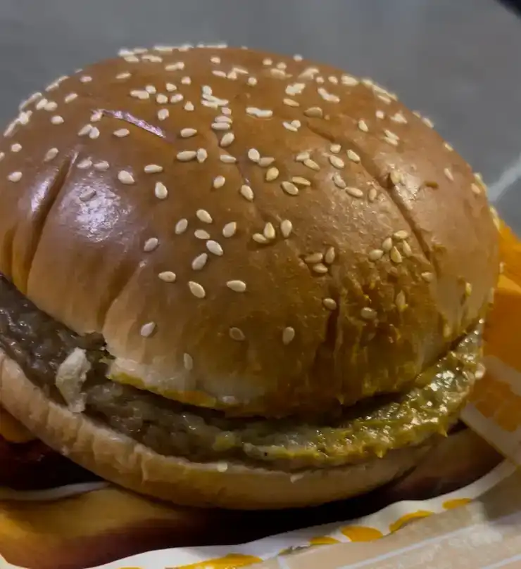 The unwrapped GS25 2300 KRW Good Deal Cheeseburger fresh out of the package