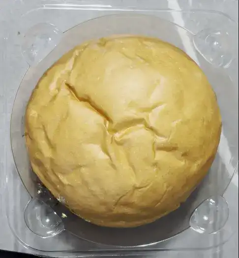 The unwrapped bread showing its vibrant green color
