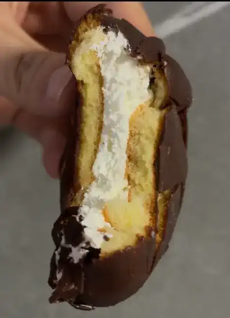 A cross-section of the pie showing the fresh cream filling instead of marshmallow