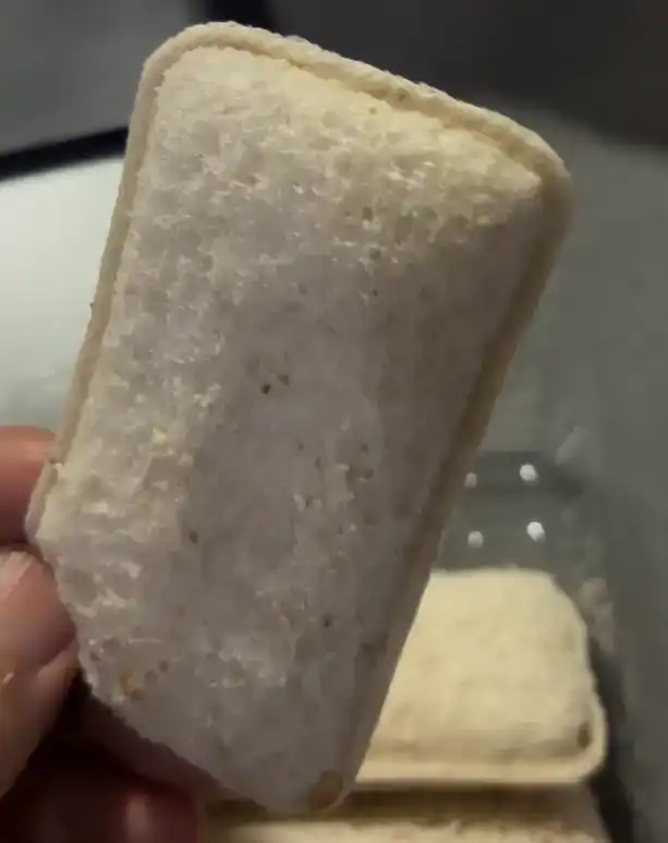 A single bite-sized piece of the Project H Whole Wheat Milk Bite Sandwich