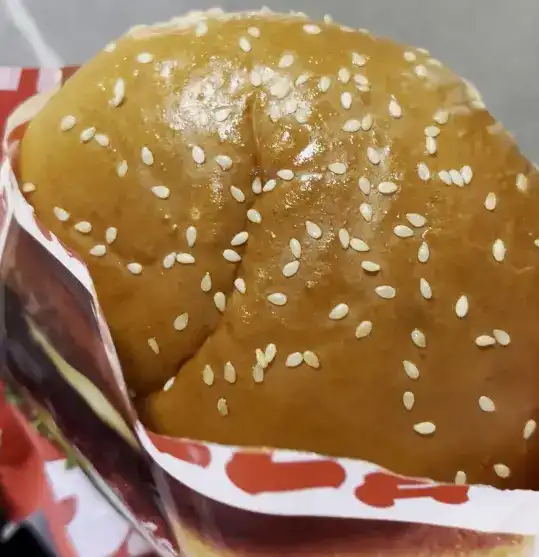 A bitten piece of the GS25 Bulgogi Burger