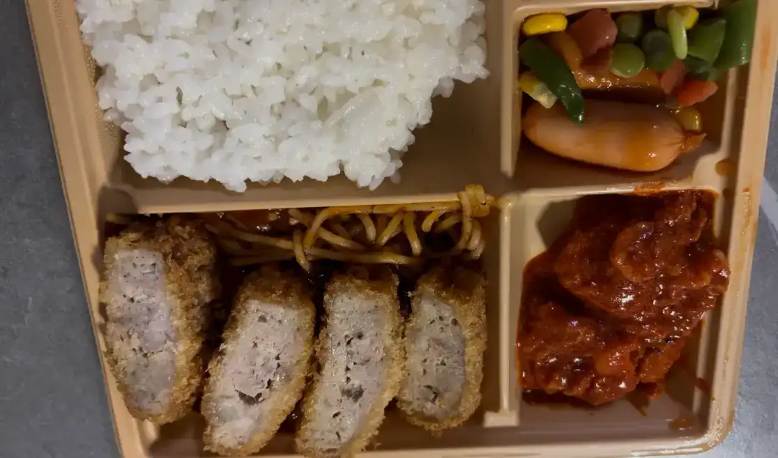 Close-up of the main dishes: Crispy Pork Cutlet and Spicy BBQ Pork
