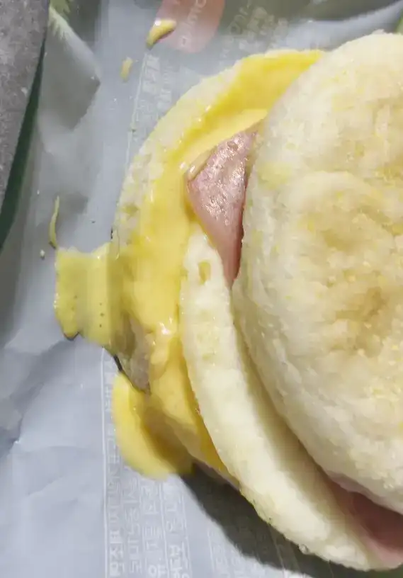 The unwrapped Ham & Egg Muffin showing the soft muffin texture