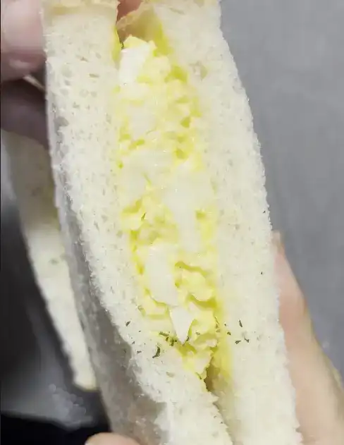 Close-up of the egg mayo section of the sandwich