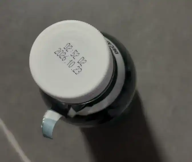 The empty bottle of the decaf americano after a painful tasting session