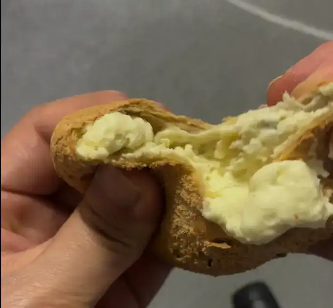 A close-up of the thick, rich custard cream filling inside