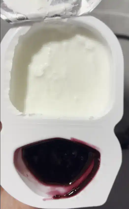 Opened GS25 Blueberry Greek Yogurt showing the neatly separated jam and yogurt