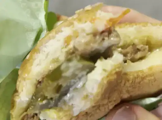 A bitten piece of the Cheongyang Mayo Burger