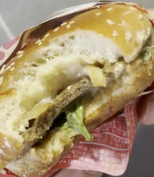 Inside view showing the fillings and sauce of the Bulgogi Burger