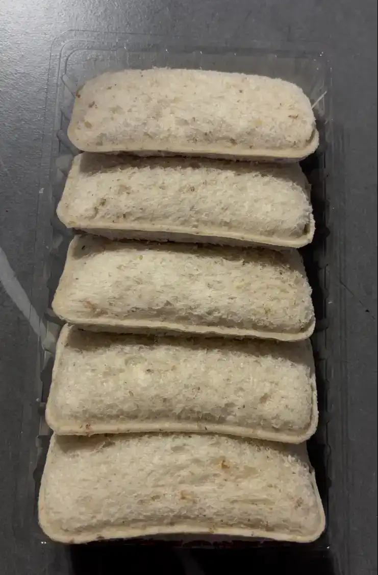 The unwrapped Project H Whole Wheat Milk Bite Sandwich squares stacked neatly