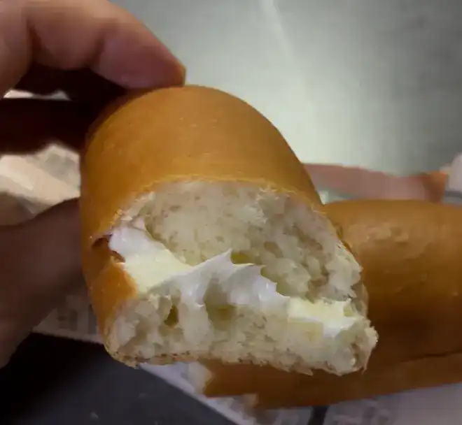 Inside filling of the GS25 Hyeja-roun Strawberry Stick Bread showing jam and cream