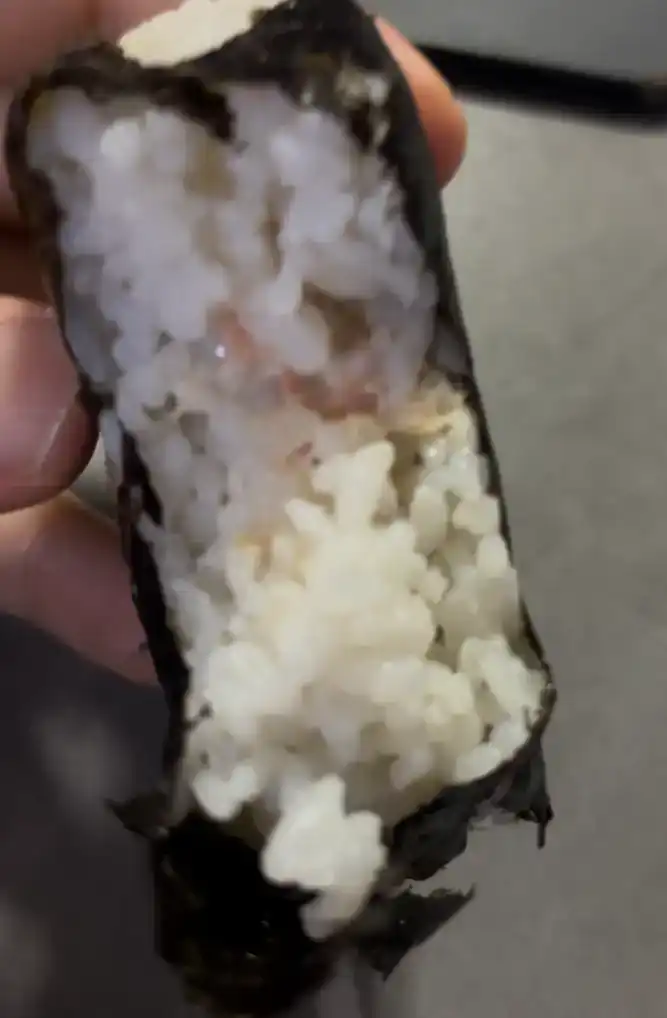 Inside look of the GS25 Light Tuna Mayo Triangle Kimbap showing the filling