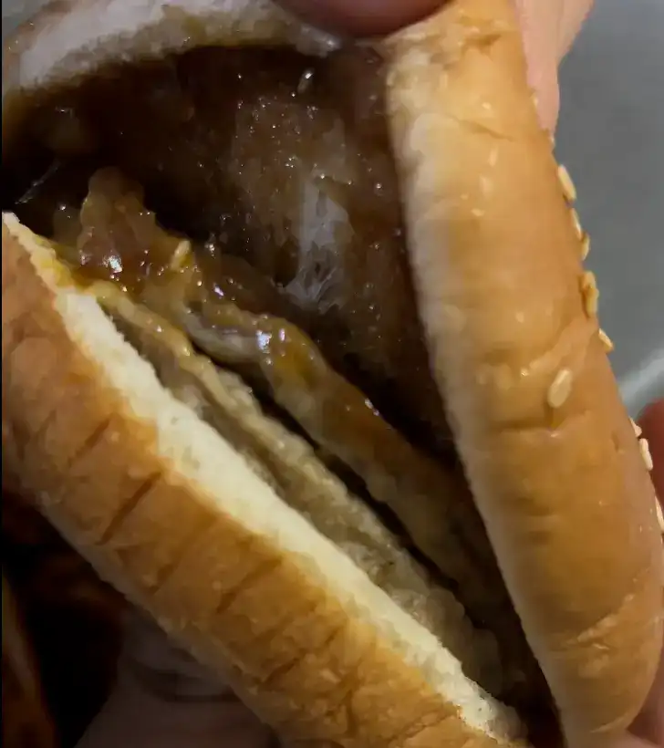 A close-up shot showing the soft, double meat patties