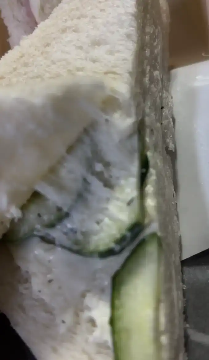 Inside look of the GS25 Ham Cucumber Cream Cheese Sandwich showing fillings