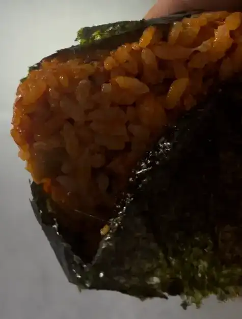 Close-up of the mushy and sticky rice texture of the gimbap